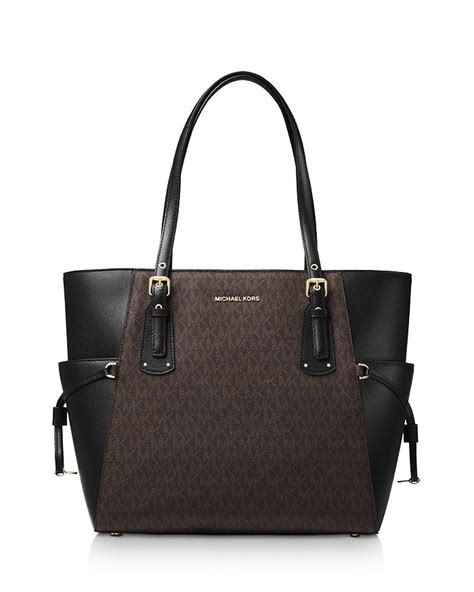 michael kors voyager east west signature tote black|Michael Kors voyager tote merlot.